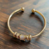 Eloura™ Adjustable Bracelet with Golden Charms